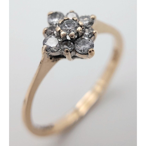 601 - A 9K YELLOW GOLD DIAMOND CLUSTER RING. 0.20CTW, 1.4G, SIZE O. Ref: JR S 98