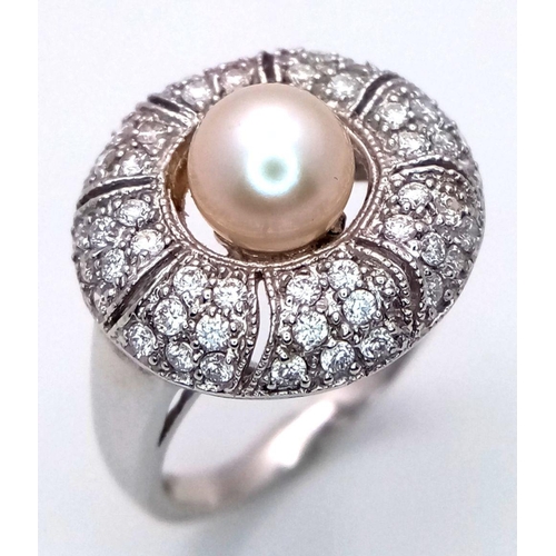 72 - AN 18K WHITE GOLD DIAMOND & PEARL SET RING. 6.1G, SIZE N. Ref: TAN 7009