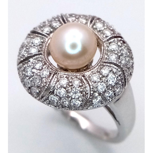 72 - AN 18K WHITE GOLD DIAMOND & PEARL SET RING. 6.1G, SIZE N. Ref: TAN 7009