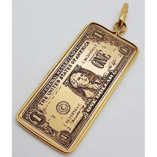 79 - AN 18K YELLOW GOLD US ONE DOLLAR NOTE PENDANT. BESPOKE MADE. 5.4G, 4.5CM LENGTH. Ref: TAN 7008