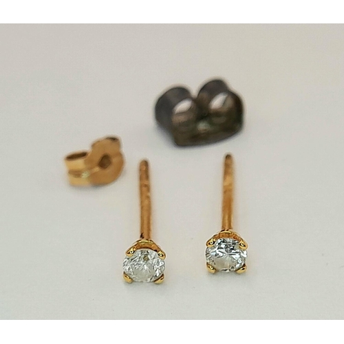 36 - A PAIR OF SMALL DIAMOND STUD EARRINGS IN 9K GOLD COMING IN A VERY CUTE PRESENTATION BOX.