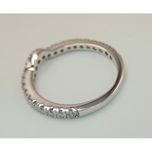 412 - AN 18K WHITE GOLD DIAMOND CURVED BAND RING 3/4 SET. 0.50CTW, 2.2G, SIZE L. Ref: SC 9045