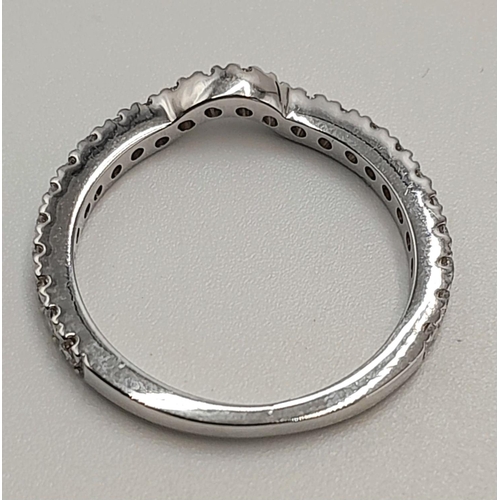 412 - AN 18K WHITE GOLD DIAMOND CURVED BAND RING 3/4 SET. 0.50CTW, 2.2G, SIZE L. Ref: SC 9045