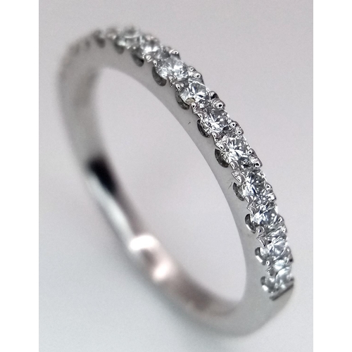 419 - A 18K WHITE GOLD DIAMOND SET HALF ETERNITY RING 0.35CT 2.5G SIZE L. Ref: SC 9044