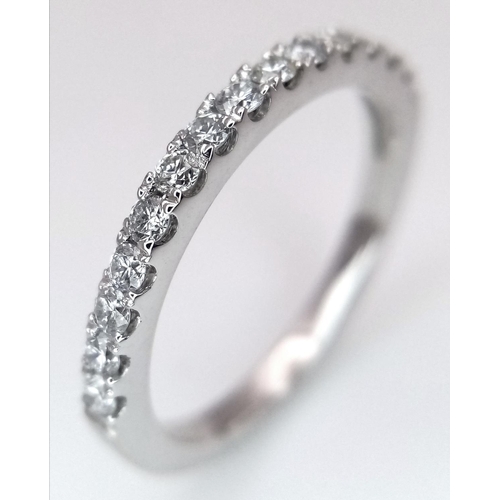 419 - A 18K WHITE GOLD DIAMOND SET HALF ETERNITY RING 0.35CT 2.5G SIZE L. Ref: SC 9044