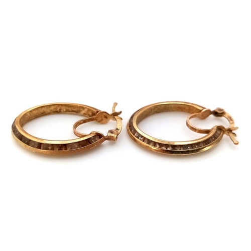 449 - A Pair of 9K Yellow Gold Oval Hoop Earrings. 2.5cm. 4.5g.