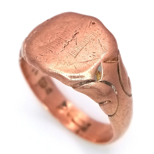 47 - AN ANTIQUE 9K ROSE GOLD GENTS SIGNET RING WITH SHIELD SHAPE FACE AND ORNATE SHOULDERS .   6.1gms    ... 