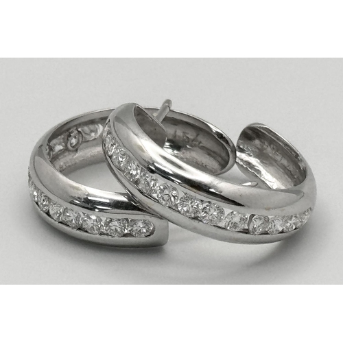 65 - A PAIR OF 18K WHITE GOLD DIAMOND SET 1/2 HOOP EARRINGS. 1.54CTW, 8.9G, 2.2CM DIAMETER. NEED BUTTERFL... 