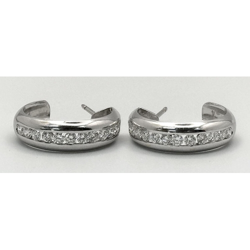 65 - A PAIR OF 18K WHITE GOLD DIAMOND SET 1/2 HOOP EARRINGS. 1.54CTW, 8.9G, 2.2CM DIAMETER. NEED BUTTERFL... 