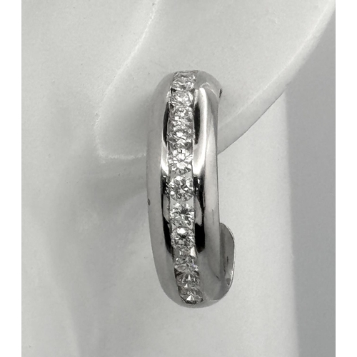 65 - A PAIR OF 18K WHITE GOLD DIAMOND SET 1/2 HOOP EARRINGS. 1.54CTW, 8.9G, 2.2CM DIAMETER. NEED BUTTERFL... 