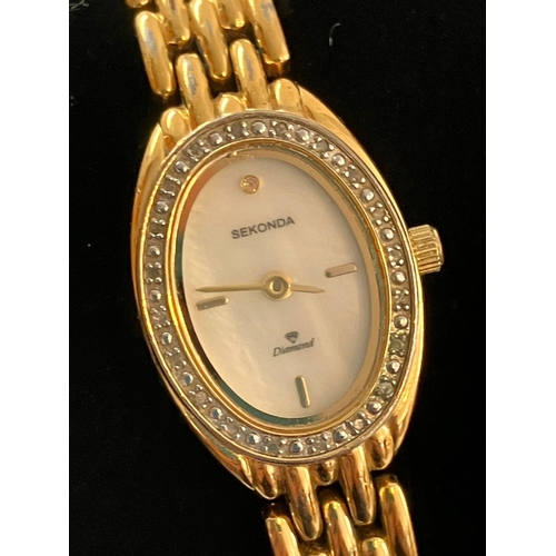 385 - Ladies SEKONDA ‘DIAMOND’ WRISTWATCH. Having oval mother of pearl face with gemstone surround. Diamon... 