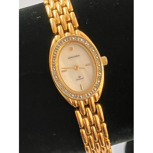 385 - Ladies SEKONDA ‘DIAMOND’ WRISTWATCH. Having oval mother of pearl face with gemstone surround. Diamon... 