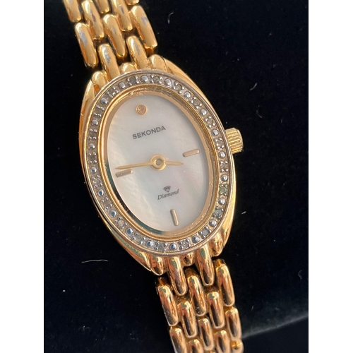 385 - Ladies SEKONDA ‘DIAMOND’ WRISTWATCH. Having oval mother of pearl face with gemstone surround. Diamon... 