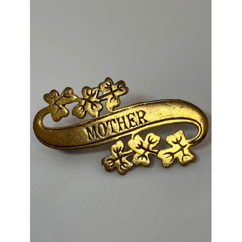 882 - Late 19th/early 20th century ‘MOTHER’  SWEETHEART BROOCH. Gilt Finished, having scroll shape with le... 