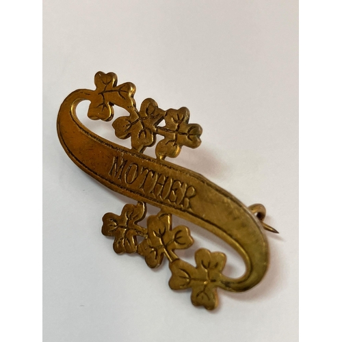 882 - Late 19th/early 20th century ‘MOTHER’  SWEETHEART BROOCH. Gilt Finished, having scroll shape with le... 