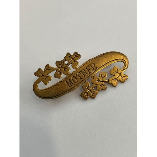 882 - Late 19th/early 20th century ‘MOTHER’  SWEETHEART BROOCH. Gilt Finished, having scroll shape with le... 