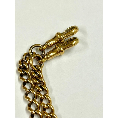 1296 - A Vintage yellow metal double Albert watch chain. 46cm in length