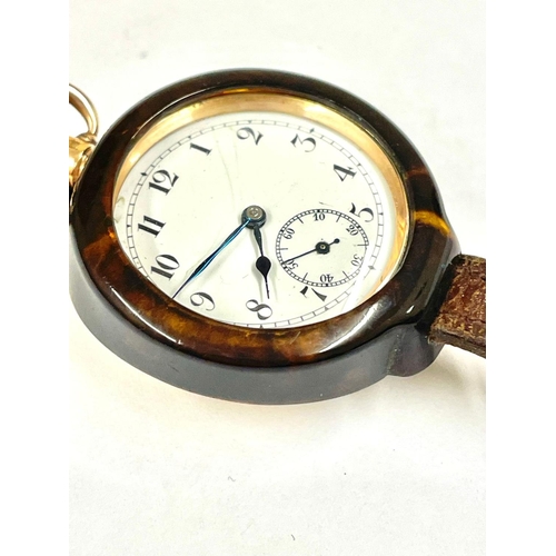 1345 - A Working Vintage ladies pocket watch & watch strap holder. Holder partly damaged but still holds th... 