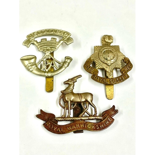 1548 - Three Military cap badges.