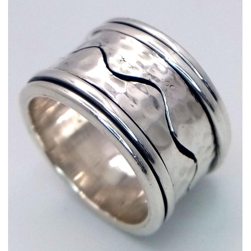 1025 - A Heavy Wide Band Sterling Silver Detailed Spinner Ring Size S. The Ring Measures 1.5cm Wide and wei... 