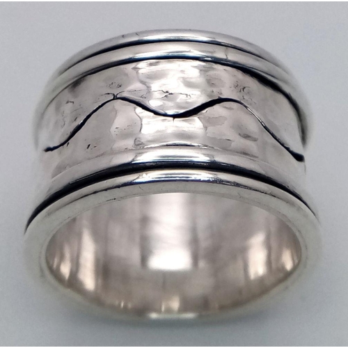 1025 - A Heavy Wide Band Sterling Silver Detailed Spinner Ring Size S. The Ring Measures 1.5cm Wide and wei... 