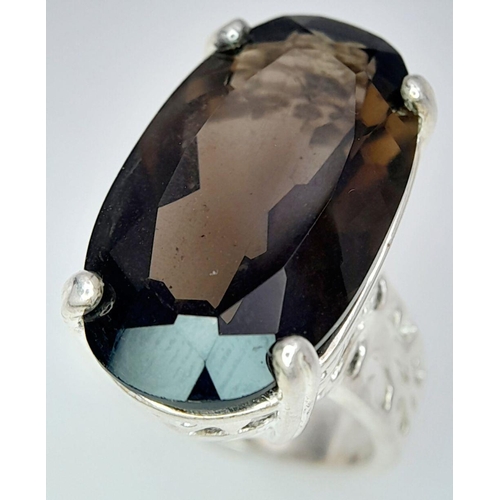 1036 - An Impressive Vintage Sterling Silver and Large Smoky Quartz Set Ring Size N. Set with a 2.5cm Lengt... 