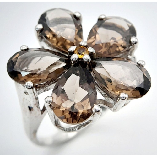 1064 - A Sterling Silver Pear Cut Smoky Quartz Flower Design Ring Size Q. The Crown Measures 2.2cm Diameter... 