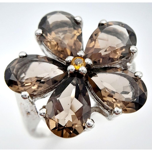 1064 - A Sterling Silver Pear Cut Smoky Quartz Flower Design Ring Size Q. The Crown Measures 2.2cm Diameter... 