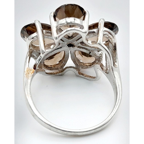 1064 - A Sterling Silver Pear Cut Smoky Quartz Flower Design Ring Size Q. The Crown Measures 2.2cm Diameter... 