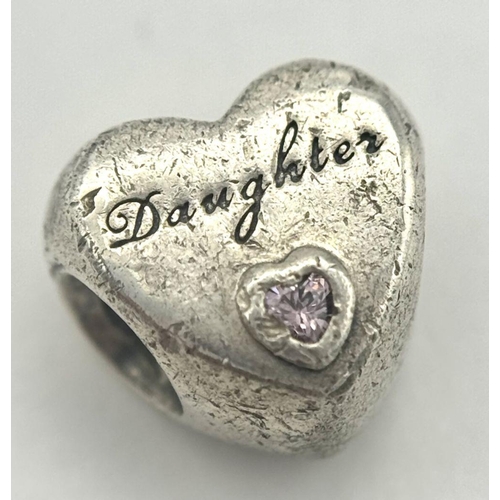 1086 - A PANDORA STERLING SILVER PINK STONE SET DAUGHTER HEART CHARM. 4G. Ref: SC 9014