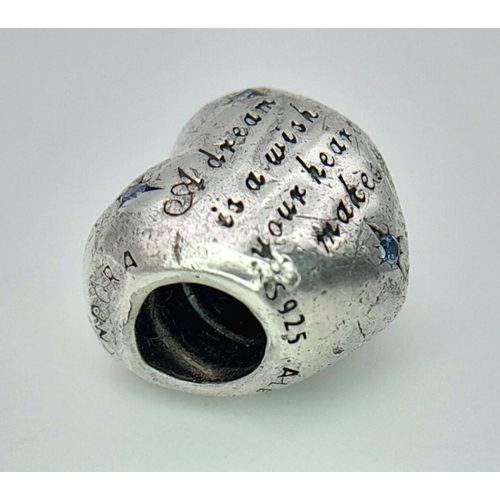 1091 - A PANDORA STERLING SILVER STONE SET HEART CHARM ENGRAVED WITH THE WORDS A DREAM IS A WISH YOUR HEART... 