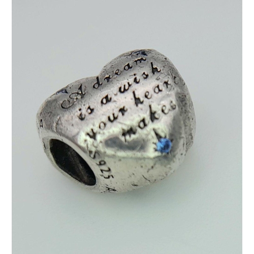 1091 - A PANDORA STERLING SILVER STONE SET HEART CHARM ENGRAVED WITH THE WORDS A DREAM IS A WISH YOUR HEART... 