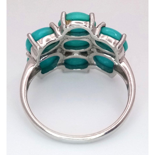 1113 - A Sterling Silver Turquoise Set Cluster Ring Size O. The Crown Measures 2x1.5cm. The Ring Weighs 3.6... 