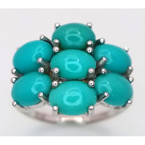 1113 - A Sterling Silver Turquoise Set Cluster Ring Size O. The Crown Measures 2x1.5cm. The Ring Weighs 3.6... 