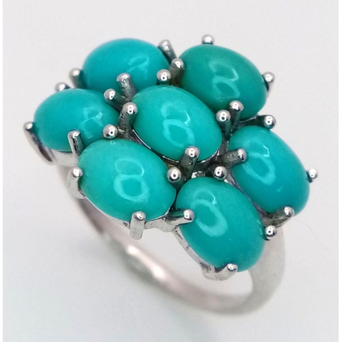 1113 - A Sterling Silver Turquoise Set Cluster Ring Size O. The Crown Measures 2x1.5cm. The Ring Weighs 3.6... 