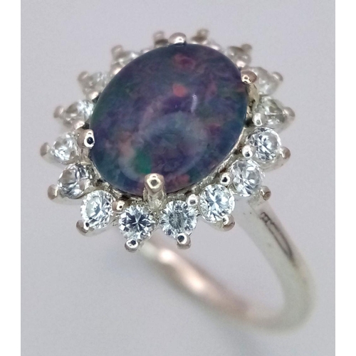 1120 - A Sterling Silver Opal and White Topaz Set Ring Size M1/2. The Ring Measures 1.5cm Long and the Crow... 