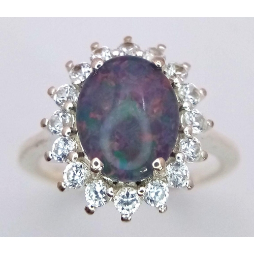 1120 - A Sterling Silver Opal and White Topaz Set Ring Size M1/2. The Ring Measures 1.5cm Long and the Crow... 