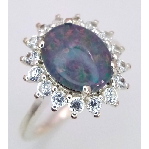 1120 - A Sterling Silver Opal and White Topaz Set Ring Size M1/2. The Ring Measures 1.5cm Long and the Crow... 