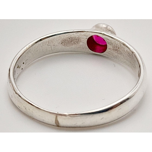 553 - Beautiful round Cut RUBY set into a SILVER BAND RING. Condition new and unworn. Size Q 1/2.