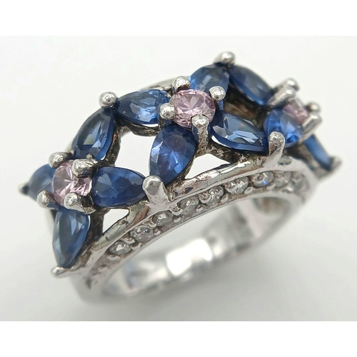 588 - A magnificent statement RING.Comprising ROYAL BLUE and CHAMPAGNE ZIRCONIA GEMSTONES Set in SILVER an... 