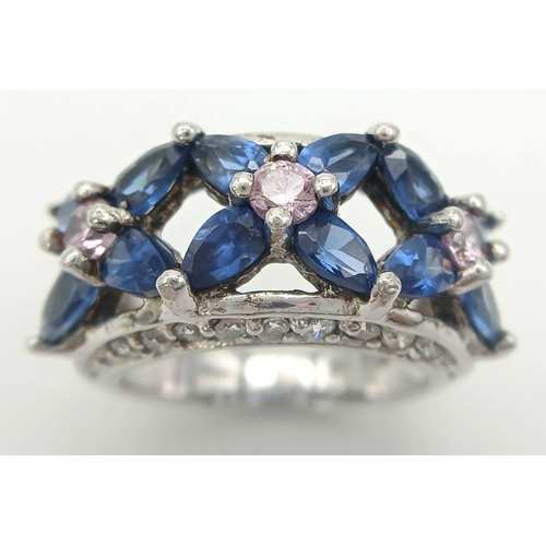 588 - A magnificent statement RING.Comprising ROYAL BLUE and CHAMPAGNE ZIRCONIA GEMSTONES Set in SILVER an... 