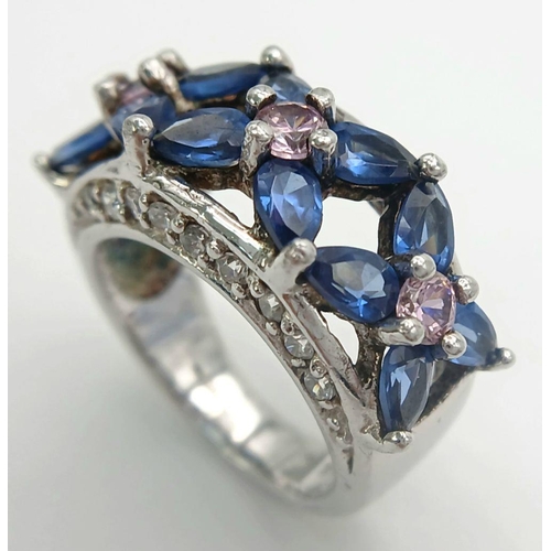 588 - A magnificent statement RING.Comprising ROYAL BLUE and CHAMPAGNE ZIRCONIA GEMSTONES Set in SILVER an... 