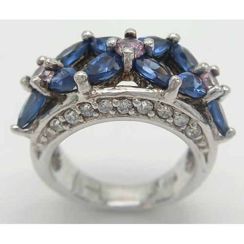 588 - A magnificent statement RING.Comprising ROYAL BLUE and CHAMPAGNE ZIRCONIA GEMSTONES Set in SILVER an... 