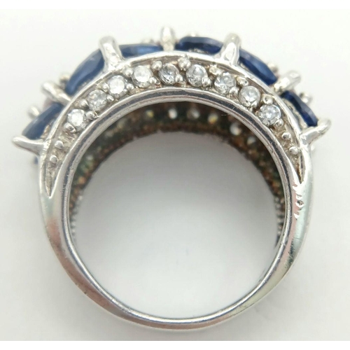 588 - A magnificent statement RING.Comprising ROYAL BLUE and CHAMPAGNE ZIRCONIA GEMSTONES Set in SILVER an... 