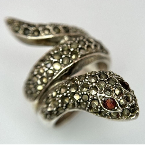 616 - Vintage SILVER MARCASITE SNAKE RING. Consisting a large coiled SILVER RING complete with red gemston... 