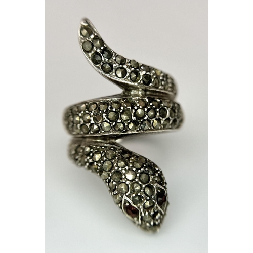 616 - Vintage SILVER MARCASITE SNAKE RING. Consisting a large coiled SILVER RING complete with red gemston... 