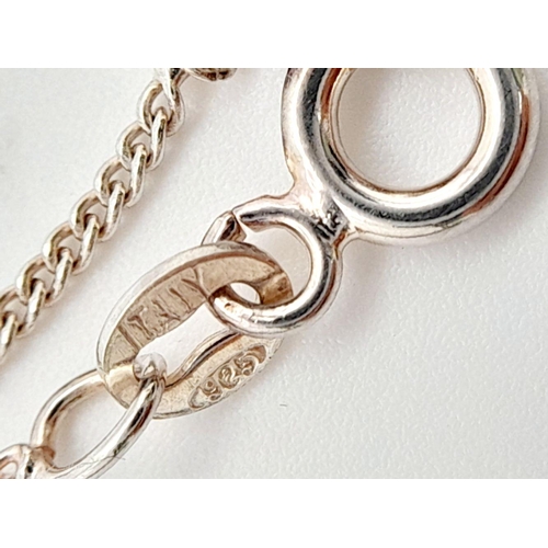 791 - A genuine Paul Kennedy SILVER BABY SLIPPER PENDANT mounted on a fine Italian SILVER CHAIN NECKLACE. ... 