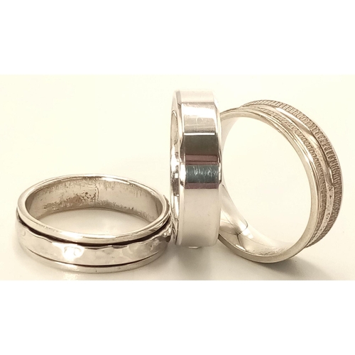 825 - A 3 X STERLING SILVER BAND RINGS, ONE IS A FIDGET RING WITH SPINNING CENTRE 18.6G , ALL SIZE V. Ref:... 