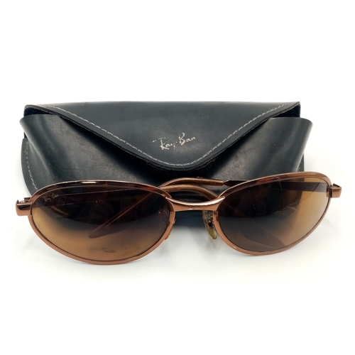 1179 - A Pair of Vintage Ladies Ray Bans Sunglasses. Come with an orginal case.