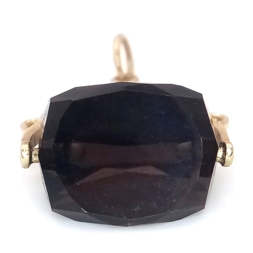 1216 - A 9K Yellow Gold Smoky Quartz Spinning Fob Pendant. 2.5cm. 3g total weight.